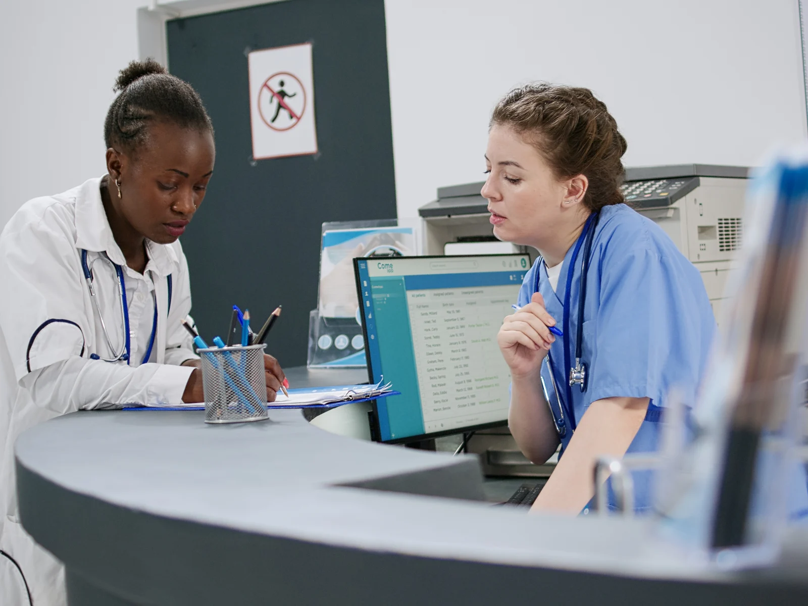 Clinicians working with a digital patient system