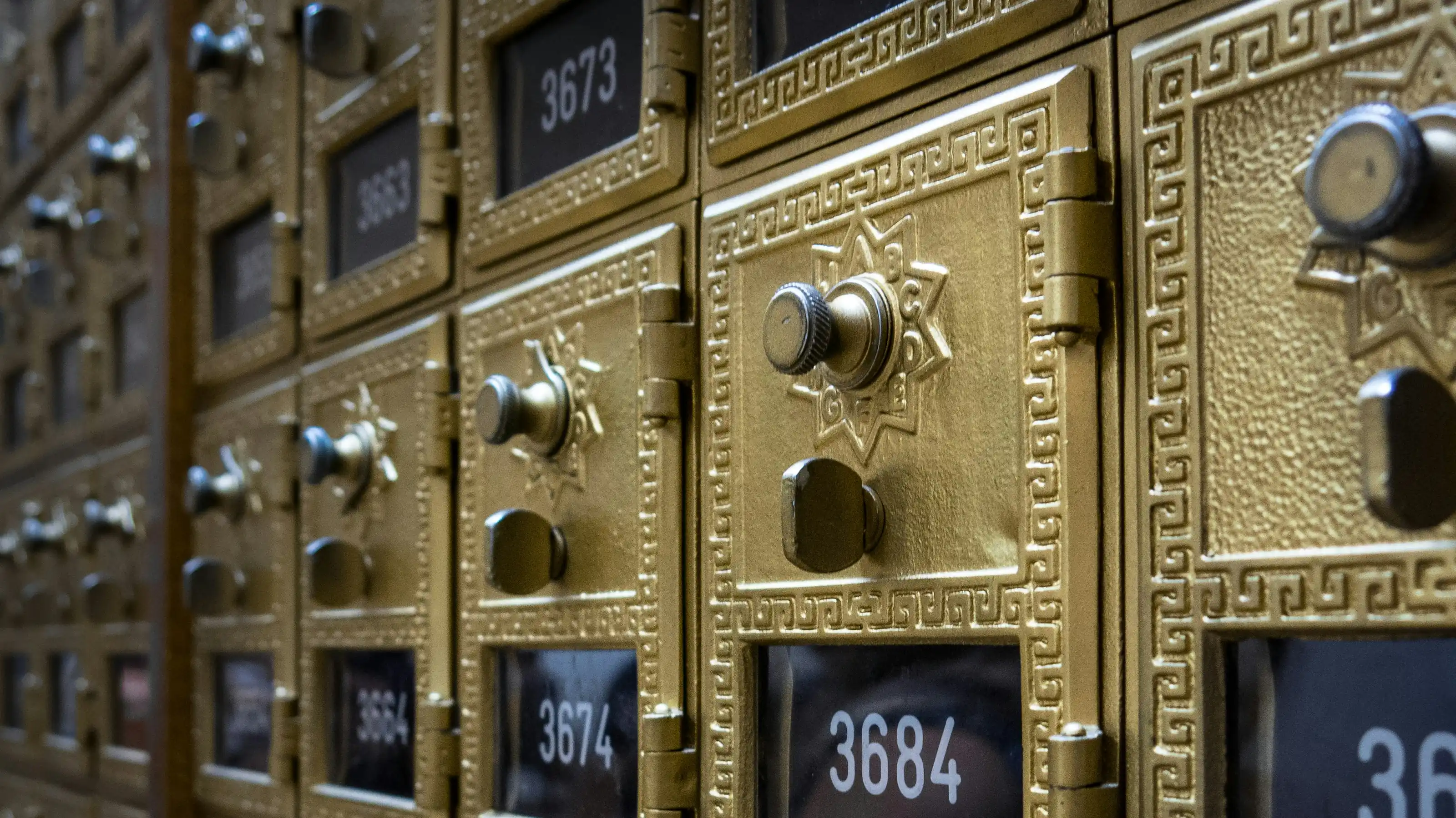A grid of numbered metal letterboxes